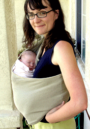 Laurel-with-Maddie-in-pouch-smile-cropped.gif